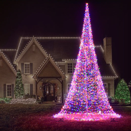 Multicolor LED flagpole Christmas tree for residential outdoor Christmas yard decorations in front of a house