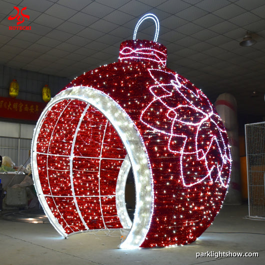 HOYECHI red LED Christmas ball arch with white bow outline festive walk-through ornament for commercial outdoor Christmas decoration projects