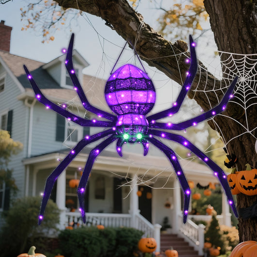 HOYECHI 4.2ft hanging Halloween spider with 90 purple LED lights and green eyes on tree in front yard
