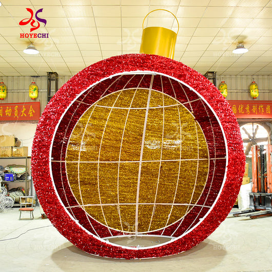 Unlit HOYECHI Christmas ball arch red and gold tinsel wrapped steel frame giant ornament sphere ready for LED installation