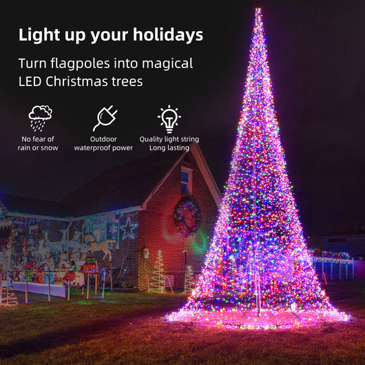 Weather-resistant outdoor LED flagpole Christmas tree shining in a snowy front yard