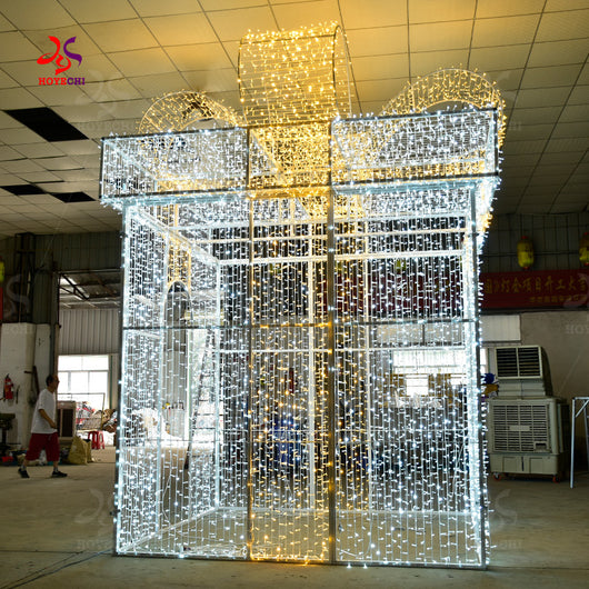 Close view of HOYECHI walk-through gift arch motif lights with warm white and cool white LEDs forming a giant present