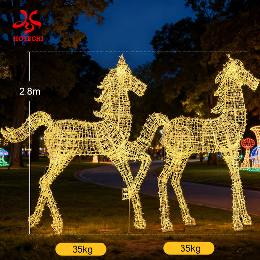 Outdoor LED horse light sculpture installed in a park night display with colorful trees