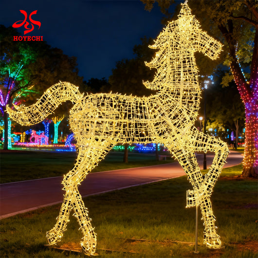 Outdoor LED horse light sculpture installed in a park night display with colorful trees