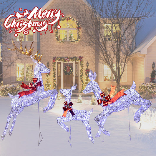 Outdoor front yard decorated with HOYECHI LED reindeer family lights at night