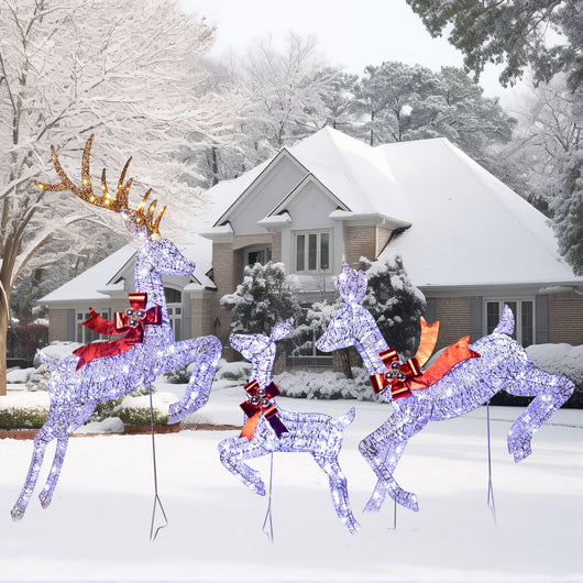 Winter holiday scene with HOYECHI brown LED reindeer lights in snow-covered yard