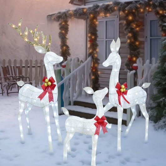 Winter holiday scene with HOYECHI white LED reindeer lights in snow-covered yard