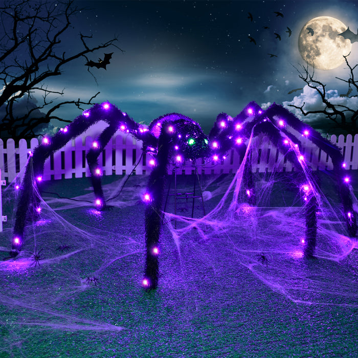 HOYECHI giant lighted spider outdoor Halloween yard decoration with purple LED lights and spider web under a full moon.